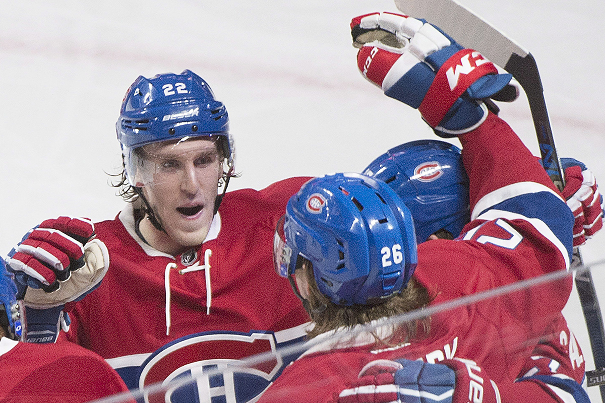 Montreal Canadiens' Jeff Petry (26) celebrates with teammate Dale Weise (22) after scoring against the Ottawa Senators during second period NHL hockey action, in Montreal, on Saturday, Dec. 12, 2015. 