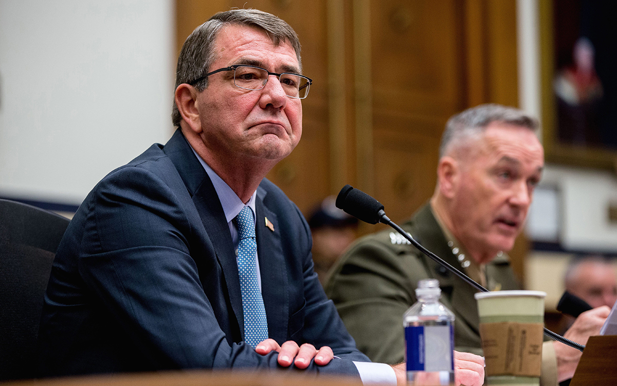 Joint Chiefs Chairman Gen. Joseph Dunford Jr., right, accompanied by Defense Secretary Ash Carter, left, testifies on Capitol Hill in Washington, Tuesday, Dec. 1, 2015, before the House Armed Services Committee hearing on the U.S. Strategy for Syria and Iraq and its Implications for the Region.