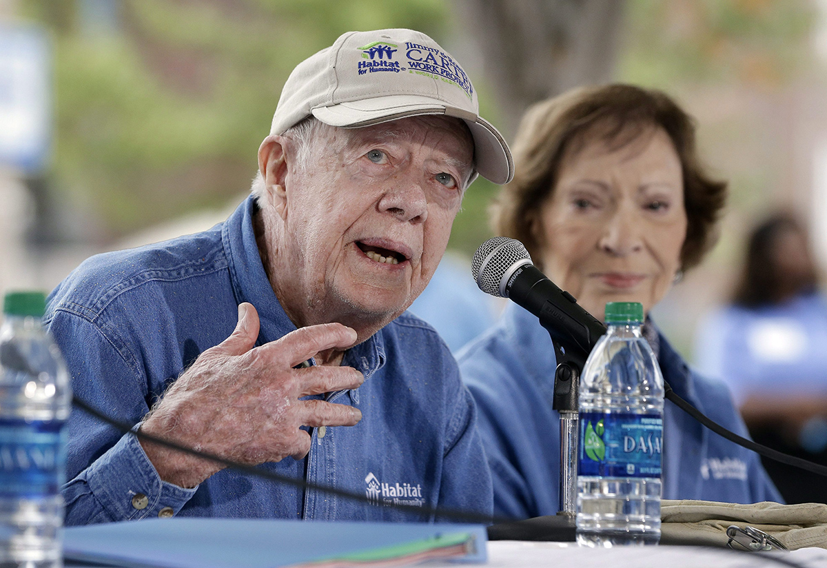 Former President Jimmy Carter and his wife, Rosalynn Carter, answer questions during a news conference at a Habitat for Humanity building site Monday, Nov. 2, 2015, in Memphis, Tenn. 