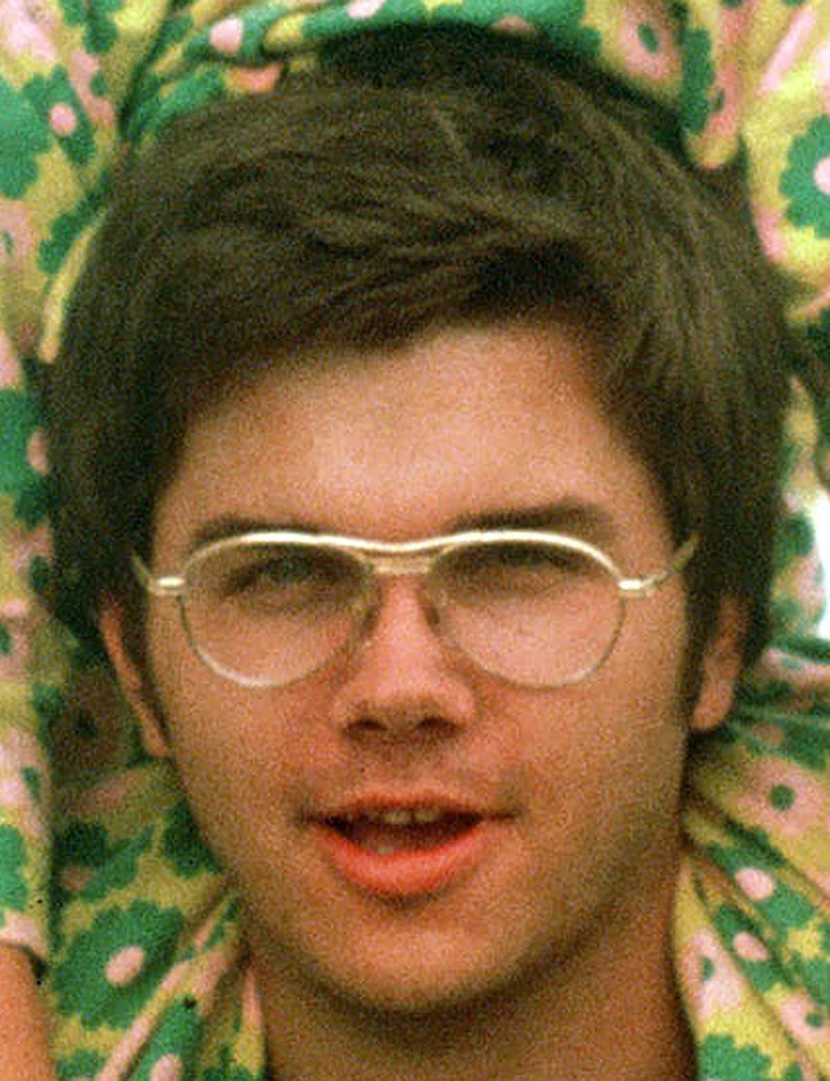 FILE – In this 1975 file photo, Mark David Chapman is seen at Fort Chaffee near Fort Smith, Ark. The man who shot John Lennon said he considered killing Johnny Carson and Elizabeth Taylor, but the ex-Beatle was more accessible. Thirty-five years ago on Dec. 8, Chapman shot and killed Lennon, a former Beatles member. (AP Photo/Greg Lyuan, File)