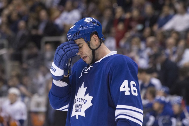 Toronto Maple Leafs' defenceman Roman Polak reacts as his team trails 6-2 to the New York Islanders during third period NHL hockey action, in Toronto, on Tuesday, December 29, 2015. 