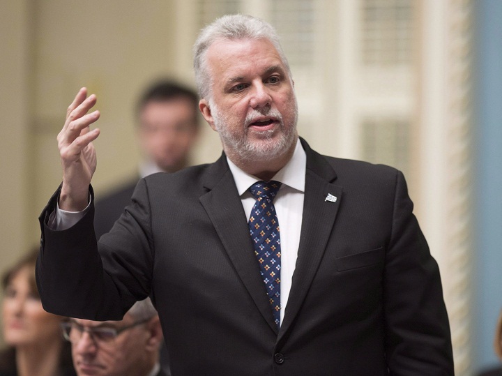 In this file photo Quebec Premier Philippe Couillard responds to the Opposition during question period Thursday, December 3, 2015 at the legislature in Quebec City. 