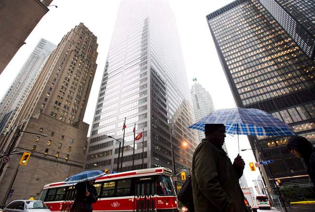 People walk in Toronto's financial district in Toronto, on Oct. 29, 2012. Islamic banking is being touted as the next big thing for Canada's financial services sector, but experts say it's up to the new federal government to demonstrate that it welcomes Shariah-compliant investments.