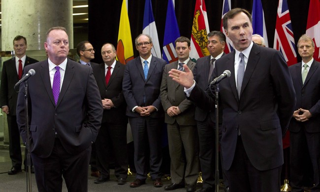 Finance Minister Bill Morneau at a news conference with his  provincial and territorial counterparts in Ottawa on Monday, December 21, 2015. 