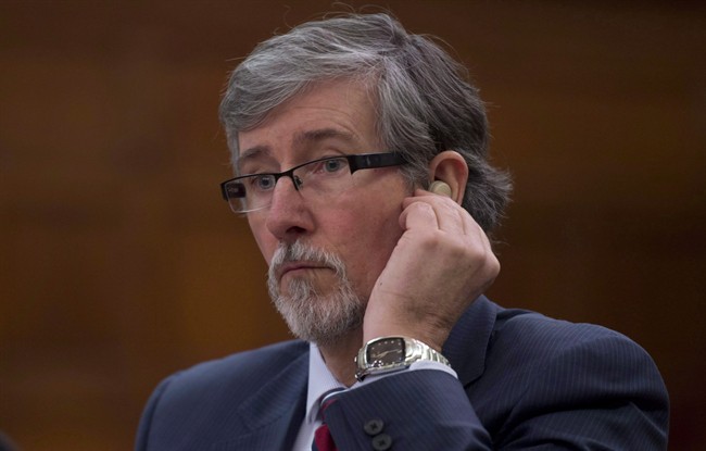 Privacy Commissioner Daniel Therrien waits to appear at the Commons science and technology committee to discuss the Digital Privacy Act, on Parliament Hill in Ottawa, Tuesday February 17, 2015. The privacy czar says there are instances - albeit very limited ones - when police may not need a warrant to obtain some Internet customer information.