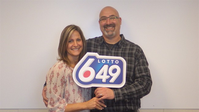 Christian and Monique Etienne pose for a photo in this recent handout photo. The Airdrie, Alta., won $14,519,825 on the December 12 Lotto 6-49 draw. 