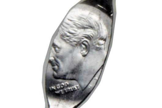 This photo provided by Heritage Auctions shows a Roosevelt Dime that was minted onto a nail. In probably one of the oddest items to come to the world of coin collecting, Heritage Auctions has announced the sale of a Roosevelt dime that was accidentally (or some say deliberately) struck onto a zinc nail.  (Heritage Auctions via AP).
