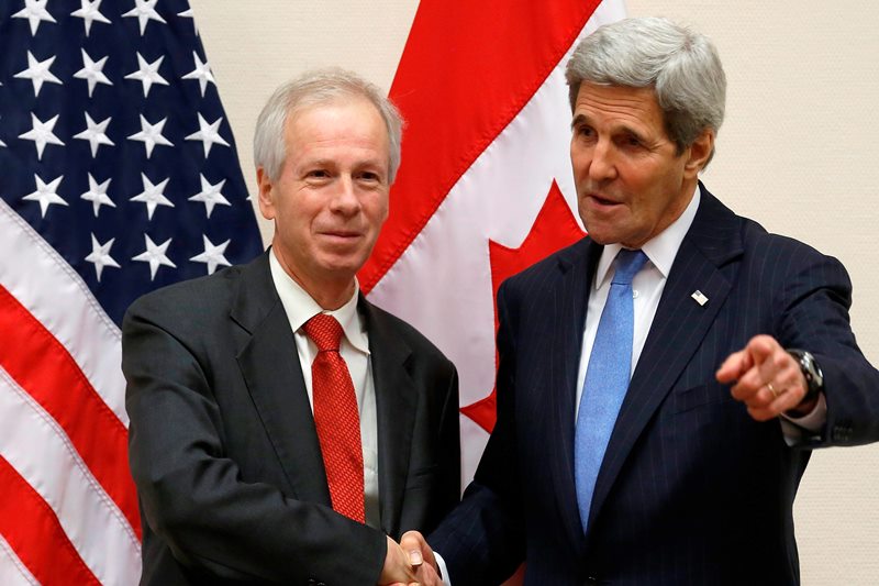 Canadian Foreign Minister Stephane Dion, left, meets with U.S. Secretary of State John Kerry alongside NATO ministerial meetings at NATO Headquarters in Brussels, Tuesday, Dec. 1, 2015.