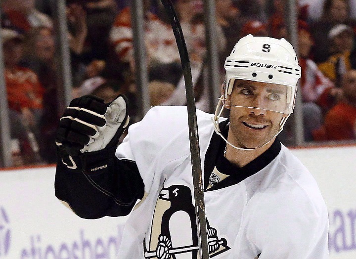 Pittsburgh Penguins right wing Pascal Dupuis celebrates his goal against the Detroit Red Wings in the first period of an NHL hockey game in Detroit on Oct. 23, 2014. 
