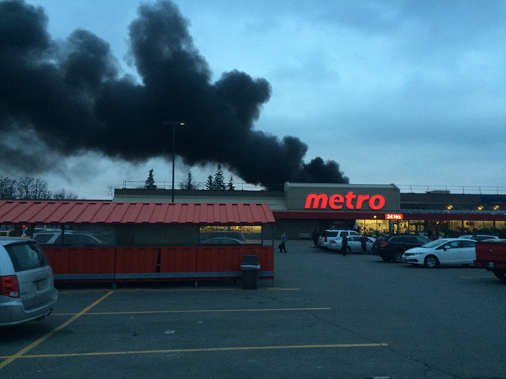 Firefighters evacuated a Tim Hortons and Metro grocery store after a truck fire on Dec. 8, 2015.