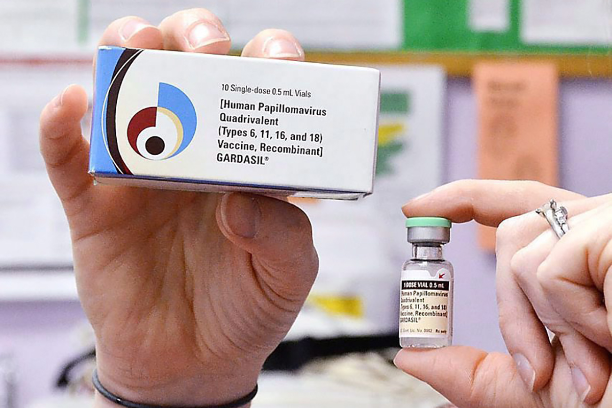 A child health nurse holds up a vial and box for the HPV vaccine, brand name Gardasil, at a clinic in Kinston, N.C. in a March 5, 2012 file photo. 