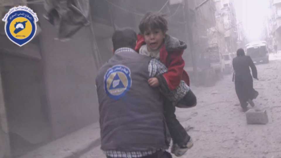One boy screams “I want my mother” as a member of the Syrian Civil Defense takes them to an ambulance.