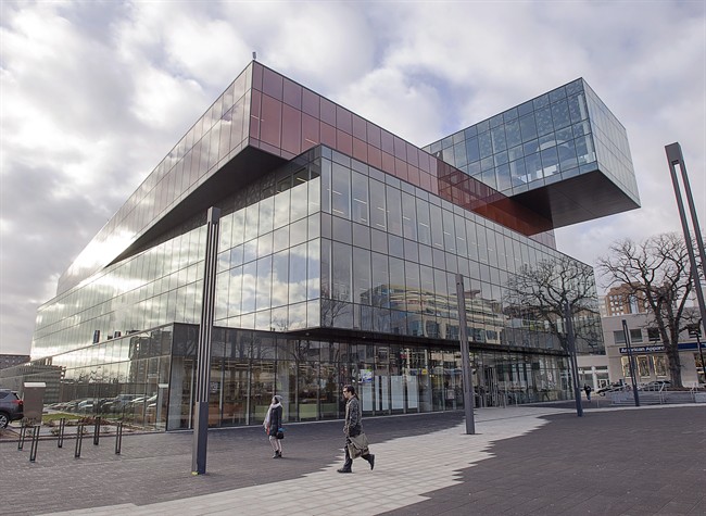 Pedestrians head past Halifax Central Library in Halifax on Wednesday, Dec. 9, 2015.