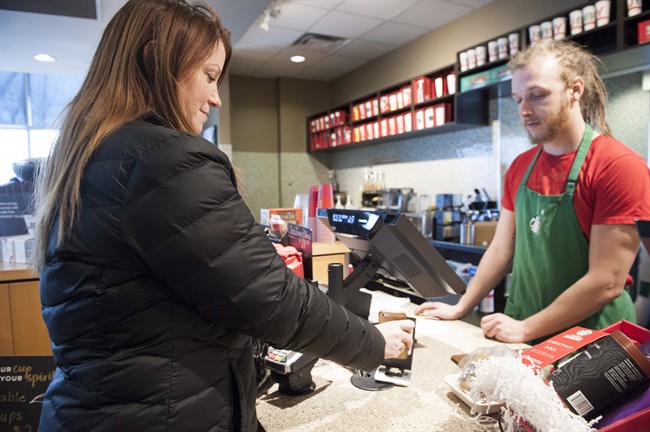Cash bypassed by more Canadians who favour their debit, credit cards - image