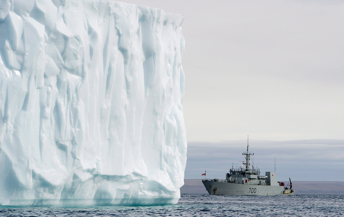 HMCS Kingston sails past an iceburg at sea on Eclipse Sound Sunday August 24, 2014 west of Pond Inlet. 