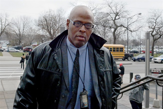 Chicago Police Commander Glenn Evans arrives at the Criminal Courts building for the start of his trial Tuesday, Dec. 8, 2015, in Chicago. Evans is accused of threatening to kill Rickey Williams and shoving his gun down Williams' throat in 2013. The commander was charged after Williams' DNA was found on Evans' gun.
