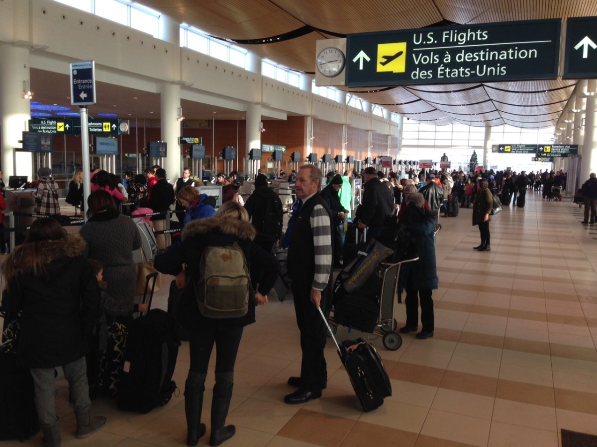 People waiting for flights at Winnipeg James Armstrong Richardson International Airport.