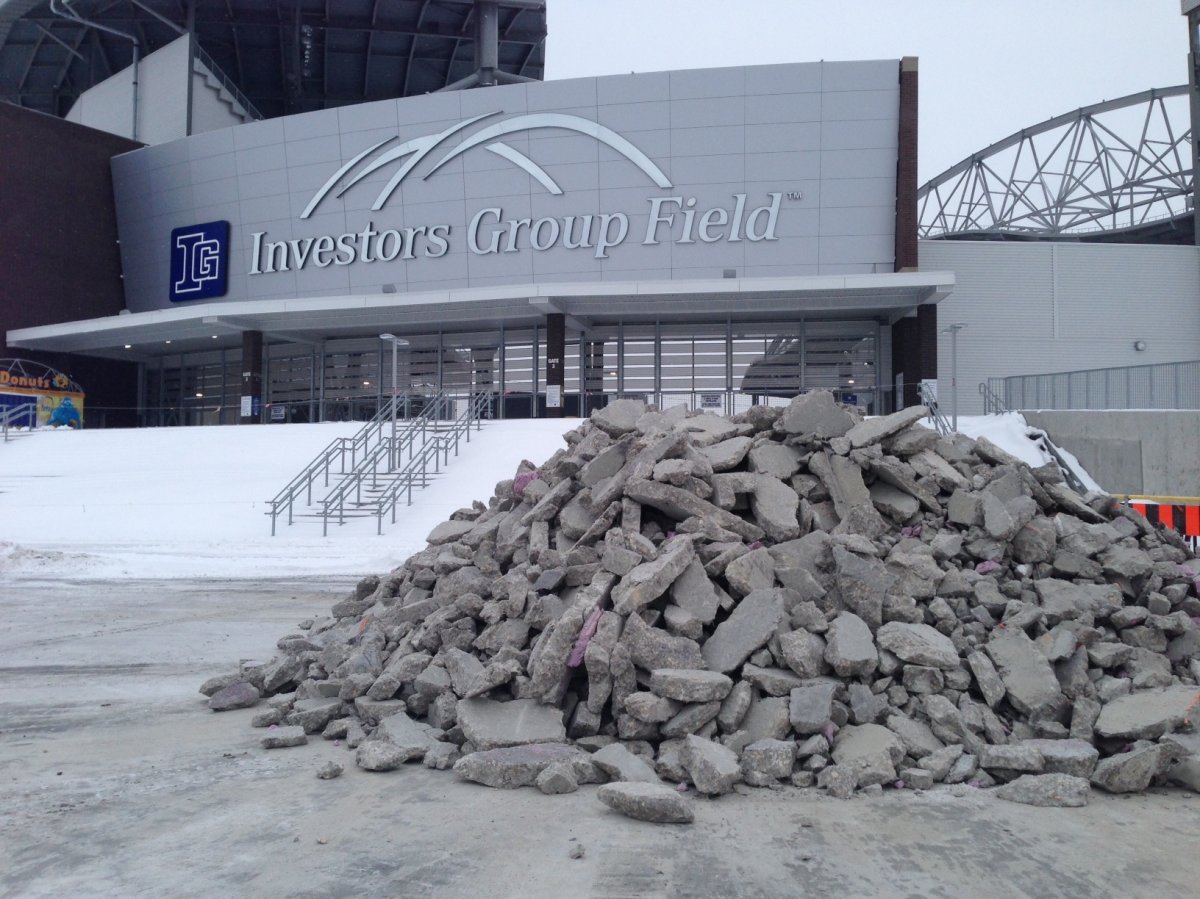 Global News spotted several piles of crushed concrete being moved away from the stadium at the University of Manitoba on Monday.