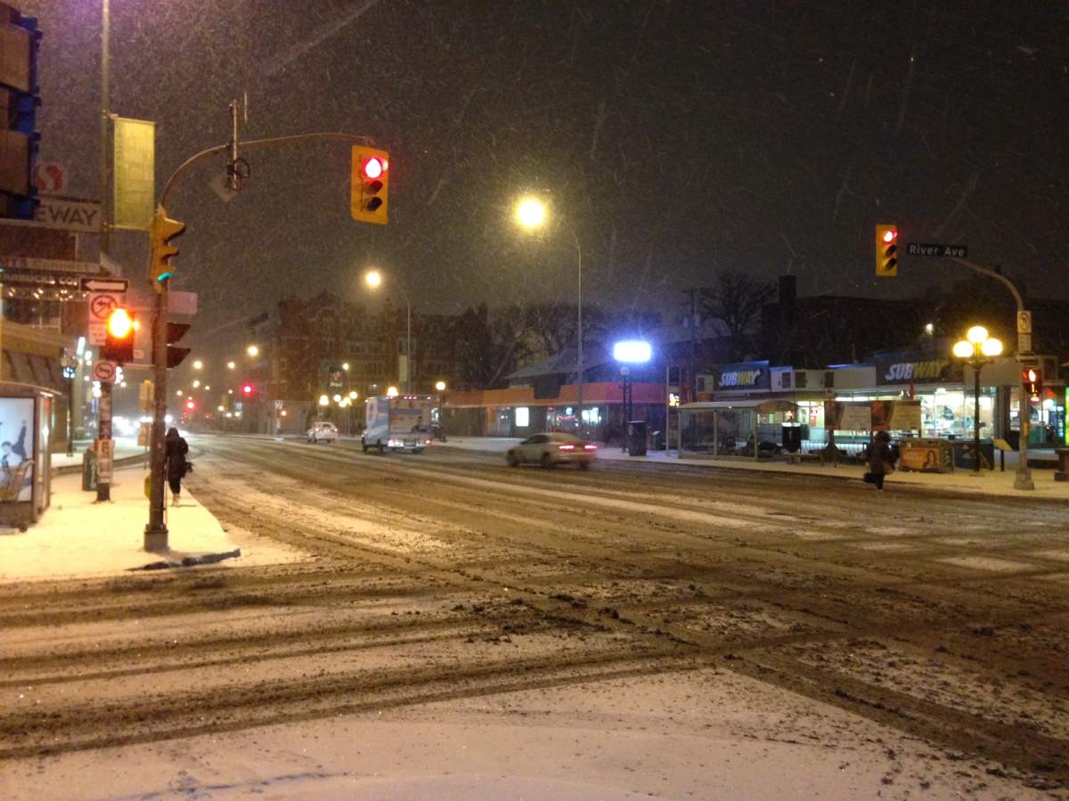 Snowy conditions on Osborne Street and River Avenue Wednesday morning.