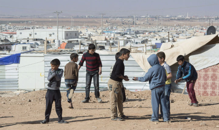 Young Syrian refugees play in the Zaatari Refugee Camp, near the city of Mafraq, Jordan, on Sunday, Nov. 29. The United Nations is calling on Jordan to let some 12,000 Syrian refugees into the country, saying the number of Syrian refugees stranded in a remote desert area on the Jordanian border
.