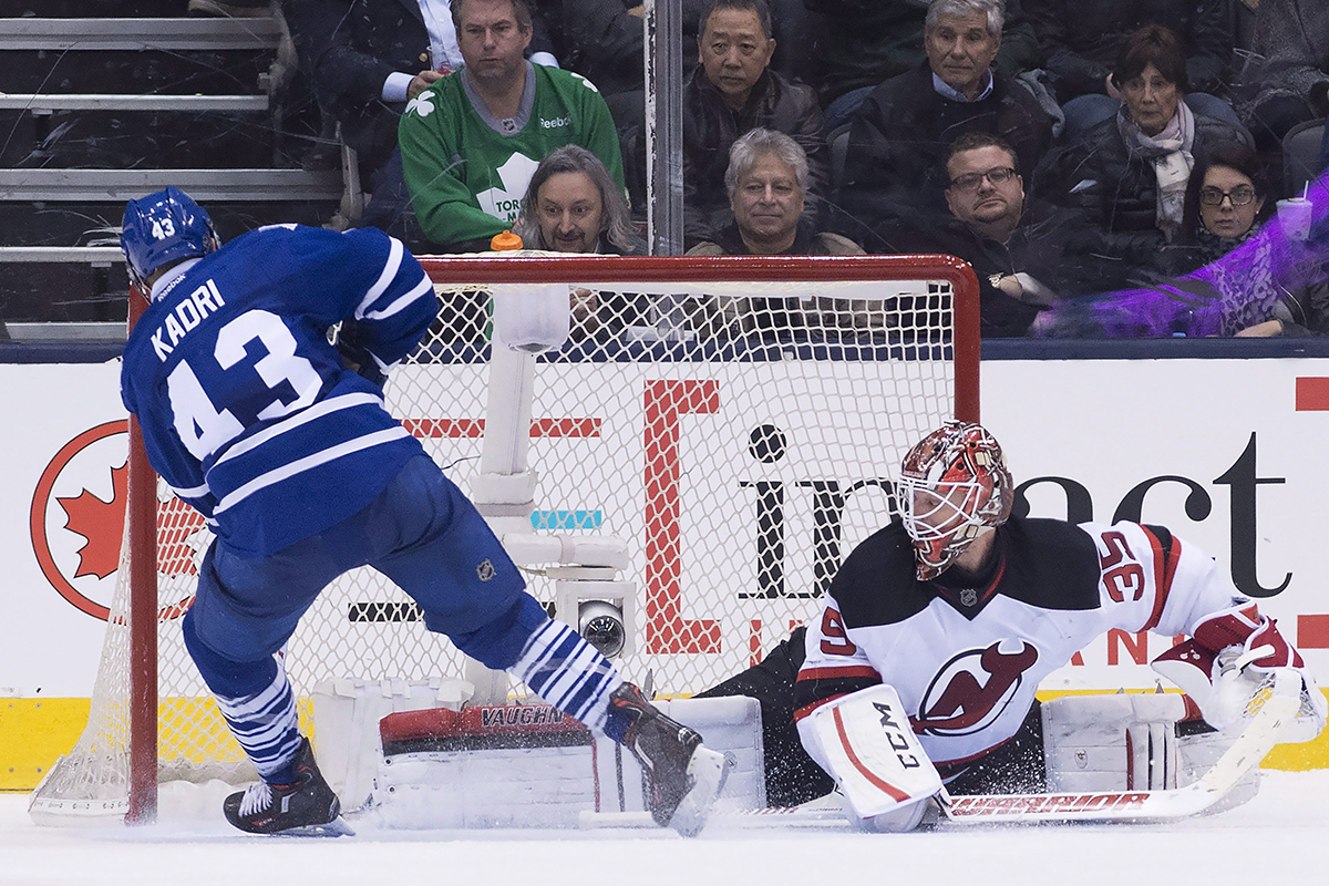 Toronto Maple Leafs' centre Nazem Kadri  scores the game winning goal in a shootout past New Jersey Devils' goalie Cory Schneider.