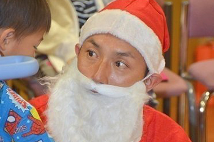 Munenori Kawasaki dressed as Santa Claus while visiting children in hospital in Kurume, Japan.