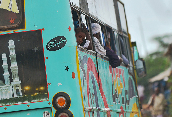 People sit in a bus north of the Kenyan capital Nairobi, April 28, 2015.  