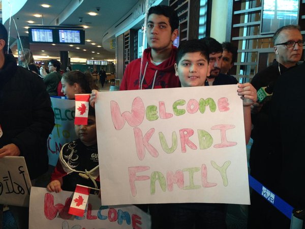 Relatives of the Kurdi family prepare to welcome them at the Vancouver International Airport. December 28, 2015. 