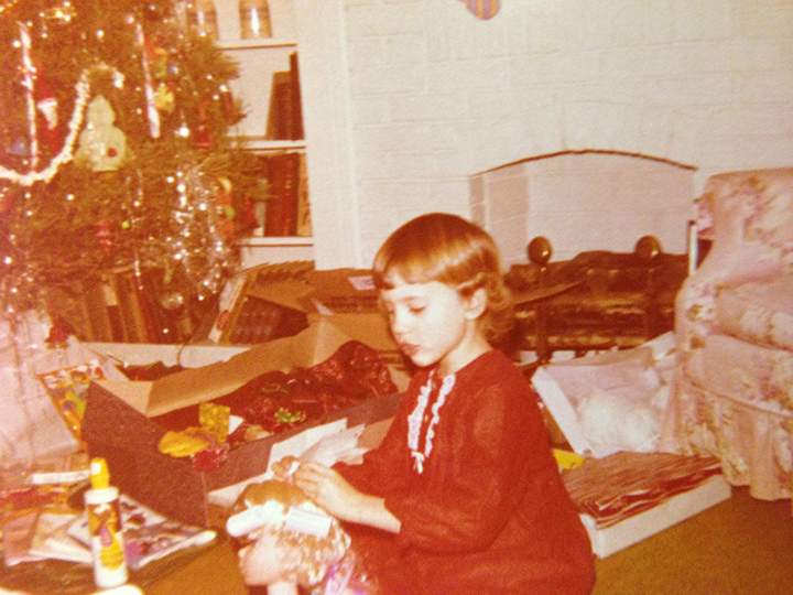 Liza as a little girl on Christmas morning.