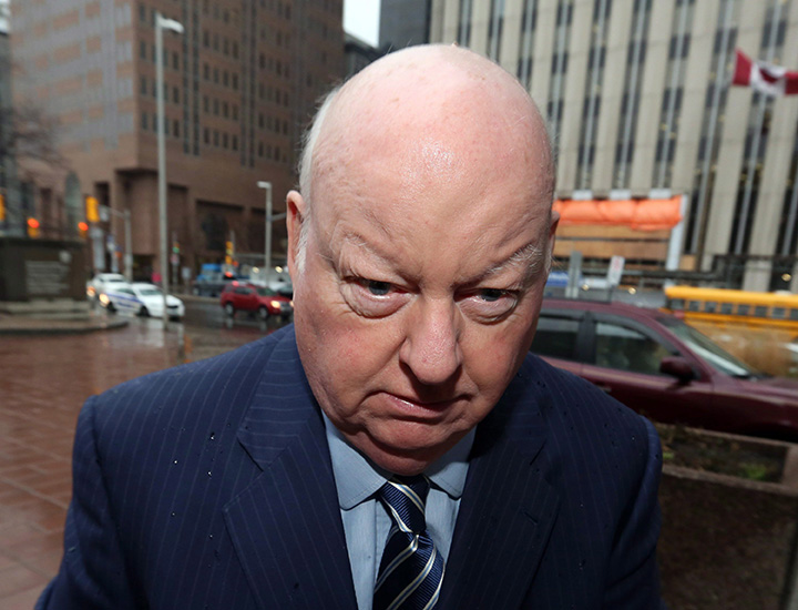 Sen. Mike Duffy, a former member of the Conservative caucus, arrives at a courthouse for his trial on Friday, November 27, 2015 in Ottawa. 