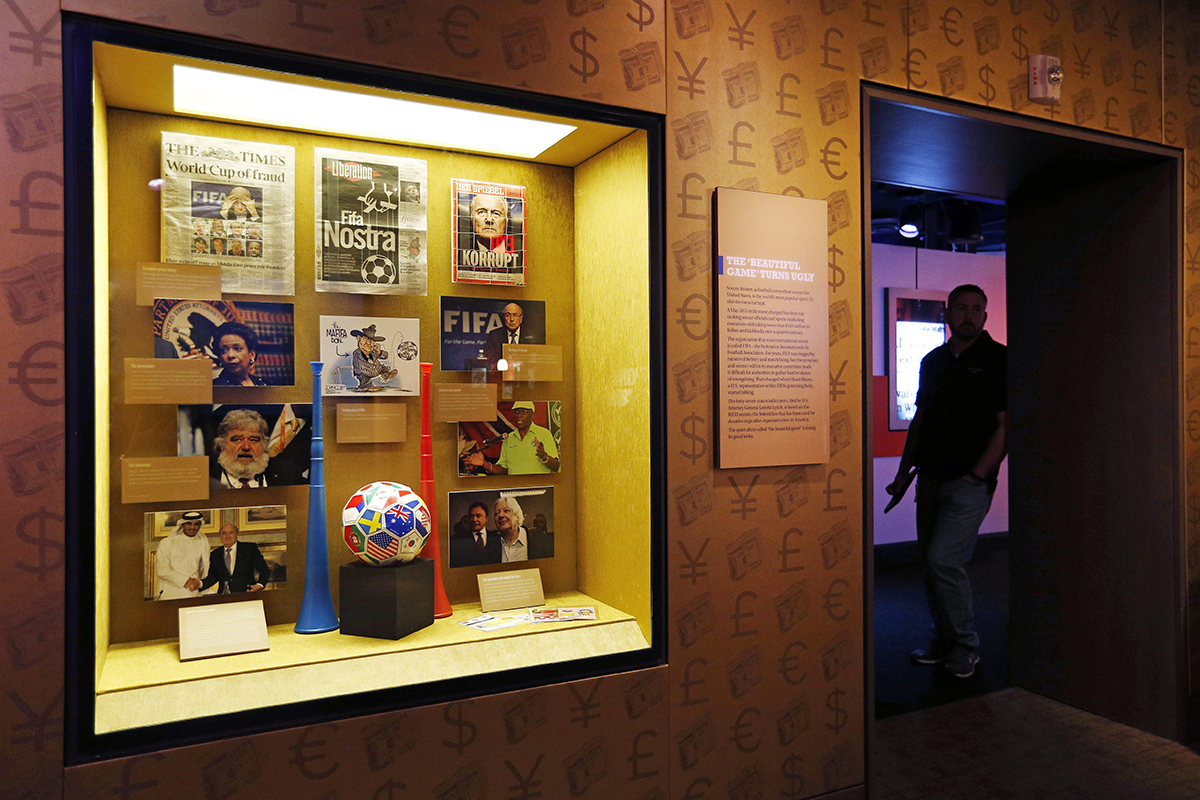 In this Tuesday, Sept. 1, 2015, file photo, Items on FIFA corruption are on display at the Mob Museum in Las Vegas. The display is titled "The 'Beautiful Game' Turns Ugly". All across Europe and the Americas as they plot legal strategy, await extradition hearings and consider the billable hours run up by their lawyers, FIFA officials can take comfort in this: They are serving the cause of art.