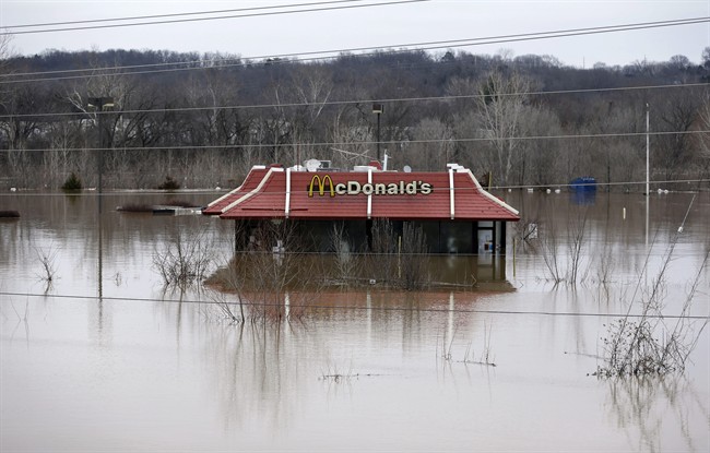 Floodwater from the Bourbeuse River surrounds a McDonald's restaurant, Tuesday, Dec. 29, 2015, in Union, Mo. Torrential rains over the past several days pushed already swollen rivers and streams to virtually unheard-of heights in parts of Missouri and Illinois. (AP Photo/Jeff Roberson).