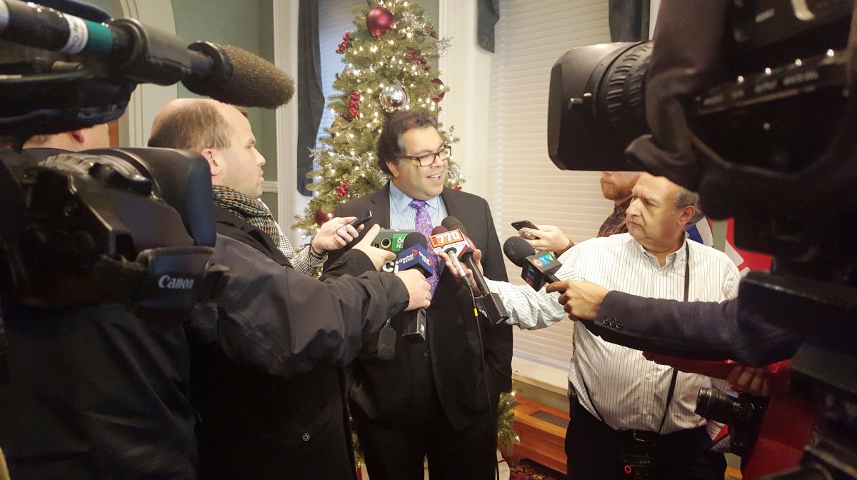 Calgary Mayor Naheed Nenshi speaks to the media about the City of Calgary's restored relationship with Uber on Friday, Dec. 11, 2015.  