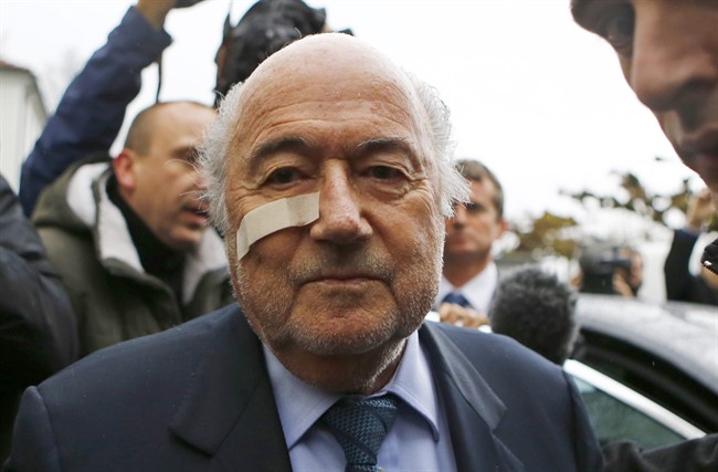 FILE - In this Dec. 21, 2015 file photo, FIFA President Sepp Blatter arrives for a news conference in Zurich, Switzerland, after he was banned for 8 years from all football-related activities over a $2 million payment by FIFA to Michel Platini, the president of European soccer's ruling body UEFA. 2015 was the year when scandals off the field of play eclipsed exploits on it. (AP Photo/Matthias Schrader, File).