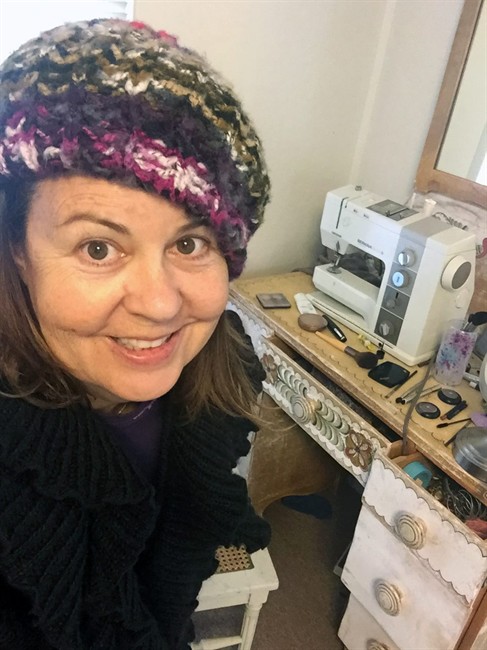 This Wednesday, Dec. 23, 2015 photo provided by Joanne Papini shows Papini in her sewing room in Walnut Creek, Calif. Her new year's resolution is to shut all drawers and cabinets and stop leaving lids and boxes half-open, believing the small step will lead to less chaos at home.