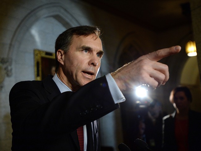 Minister of Finance Bill Morneau makes an announcement in foyer of the House of Commons on Parliament Hill in Ottawa on Friday, December 11, 2015.