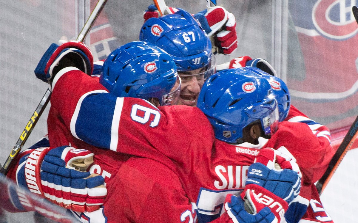Montreal Canadiens' captain Max Pacioretty (67) celebrates with teammates Dale Weise, left, and P.K. Subban after scoring against the Columbus Blue Jackets.