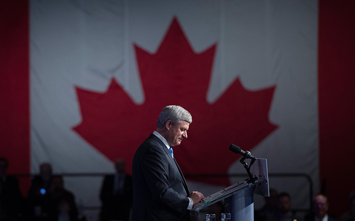 Conservative leader Stephen Harper pauses for a moment as he addresses the crowd on election night in Calgary, Monday October 19, 2015.  
