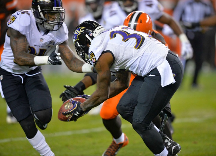 Baltimore Ravens strong safety Will Hill (33) picks up the ball and runs for the game-winning touchdown in the second half of an NFL football game against the Cleveland Browns, Monday, Nov. 30, 2015, in Cleveland. The Raven won 33-27. 