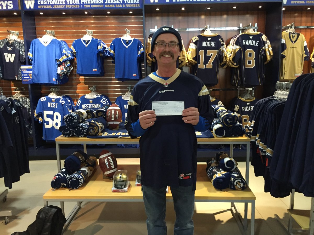 Charles Richot holds the prize in his hands in this picture on the Winnipeg Blue Bombers website.