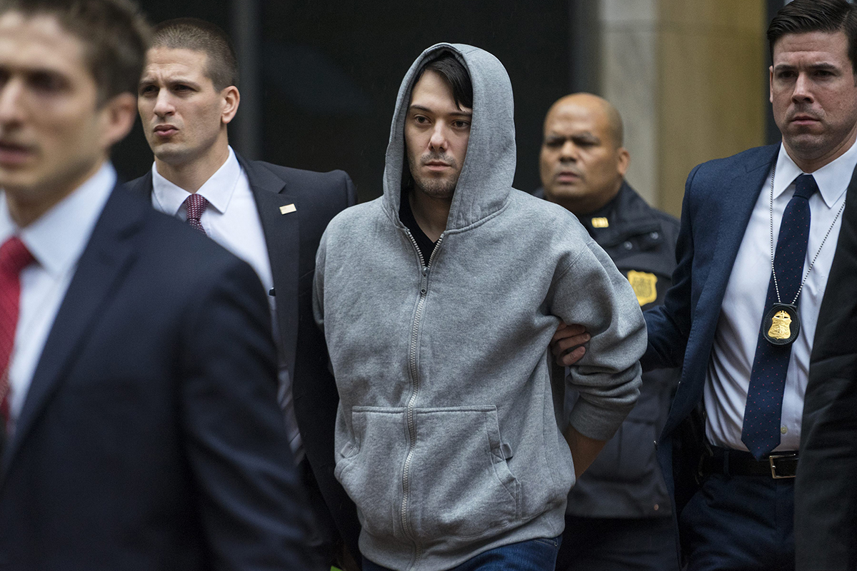  In this Dec. 17, 2015 file photo, Martin Shkreli, the former hedge fund manager under fire for buying a pharmaceutical company and ratcheting up the price of a life-saving drug, is escorted by law enforcement agents in New York.