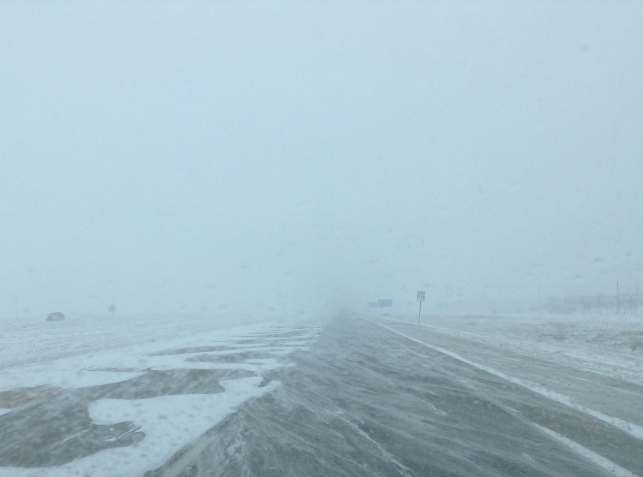 Snow blows over a roadway and limits visibility in this file photo.