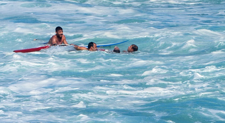 In this Sunday, Dec. 6, 2015 photo, pro surfer Evan Geiselman is rescued from the ocean at the North Shore Oahu surfing spot known as Pipeline, near Haleiwa, Hawaii. 