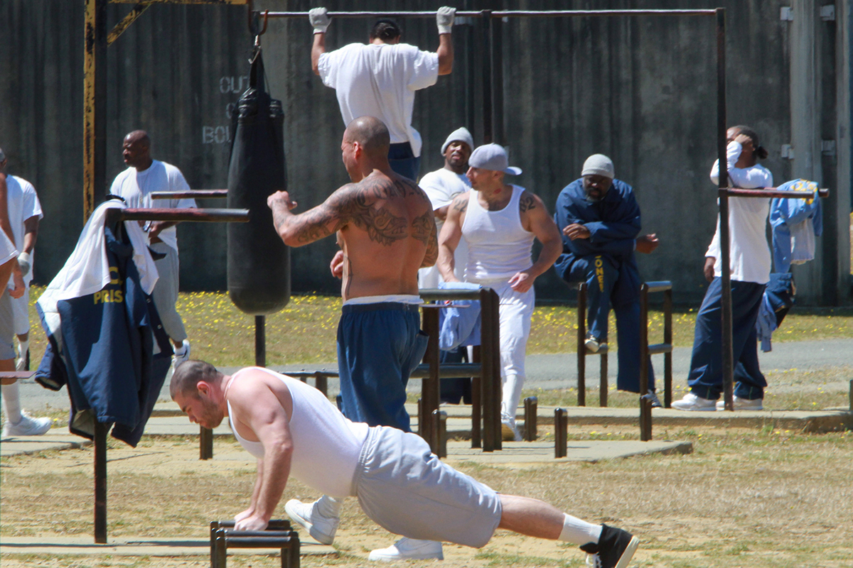 In this Aug. 17, 2011 file photo, inmates exercise in the main yard of the general population yard at the Pelican Bay State Prison near Crescent City, Calif. 