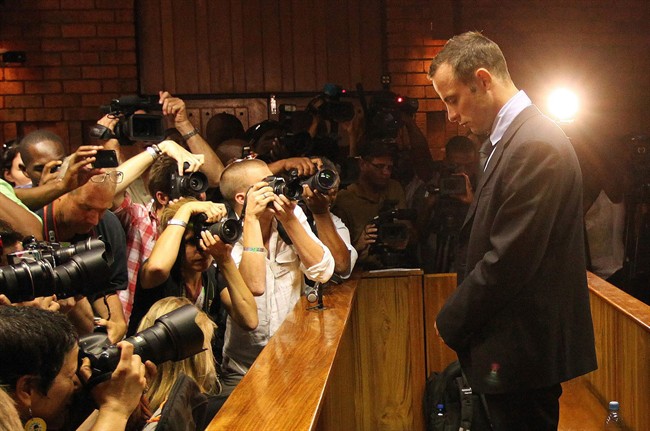  Oscar Pistorius appears at a bail hearing for the shooting death of his girlfriend Reeva Steenkamp, in Pretoria, South Africa, in this February 22, 2013 file photo. 