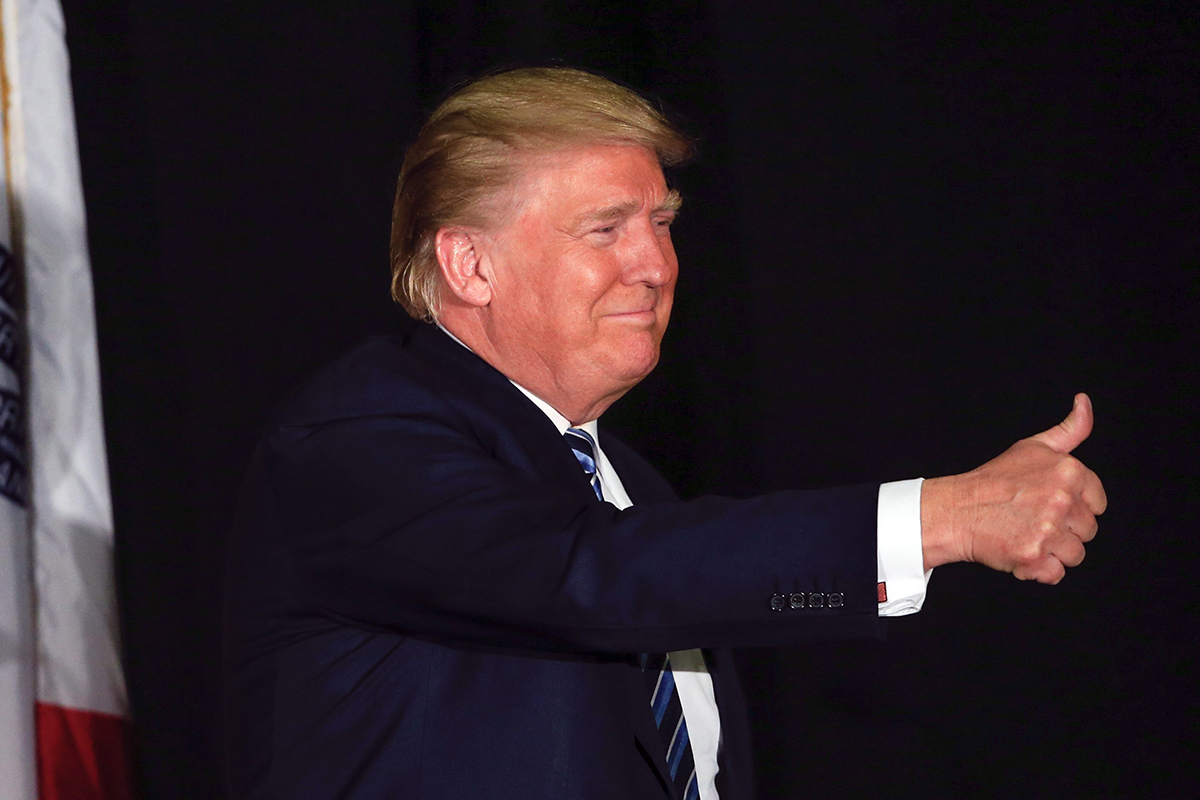 Republican presidential candidate Donald Trump gives the thumbs up during a campaign stop in Council Bluffs, Iowa, Tuesday, Dec. 29, 2015. (AP Photo/Nati Harnik).