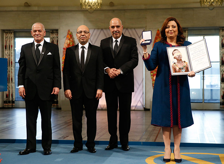 The winners of the 2015 Nobel Prize, Tunisian National Dialogue Quartet members,  from left to right,  Houcine Abassi, Mohamed Fadhel Mahfoudh, Abdessattar Ben Moussa and Wided Bouchamaoui, holding the award at the Nobel Peace Prize award ceremony in Oslo, Norway, Wednesday Dec.10. 2015. 