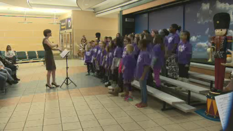 The Florence Hallock School choir performs at Edmonton International Airport.