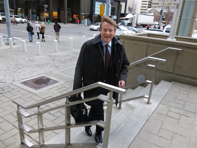 Former TV journalist Arthur Kent, who is suing PostMedia and columnist Don Martin for defamation, arrives outside of the Calgary Courts Centre prior to the start of a four week defamation trial on Friday, Dec. 11, 2015. 
