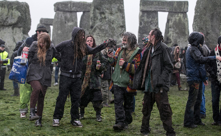 Rain falls as druids, pagans and revellers gather at Stonehenge, hoping to see the sun rise, as they take part in a winter solstice ceremony at Stonehenge on December 21, 2013 in Wiltshire, England.
